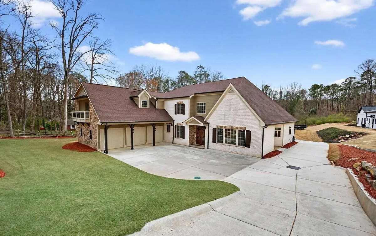 Front elevation and driveway of a custom home in Buford