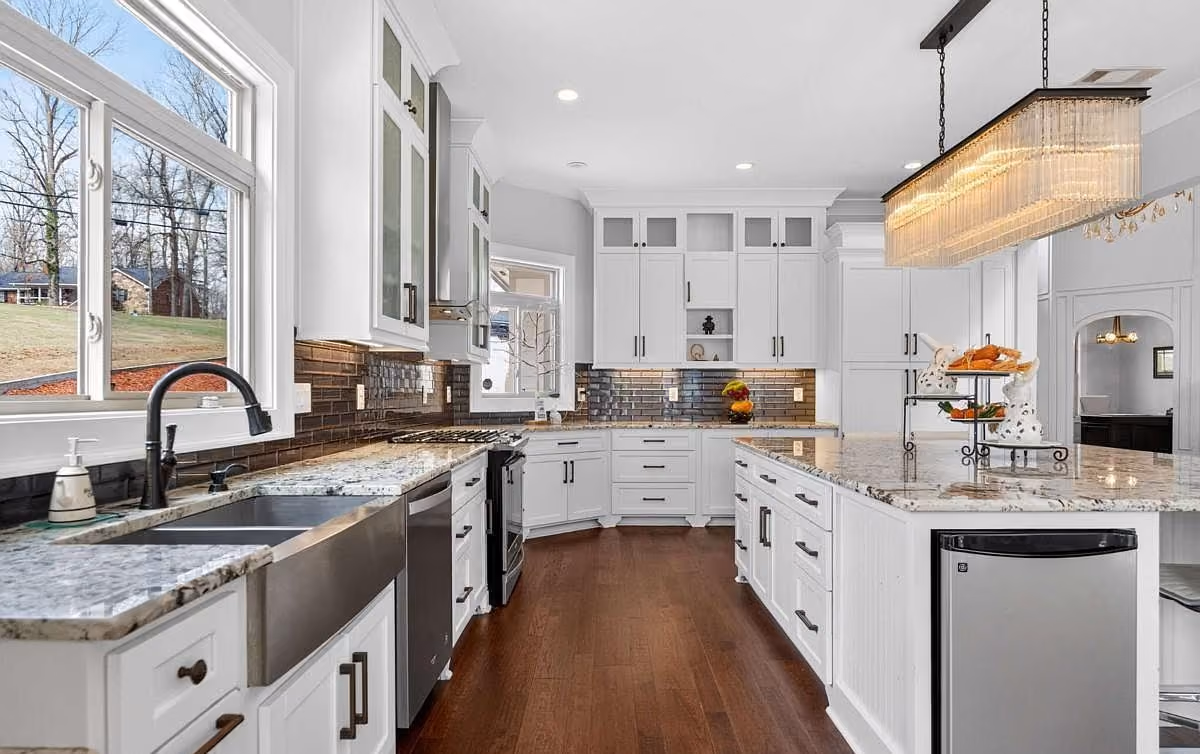 Kitchen with granite counters and a tiled backsplash